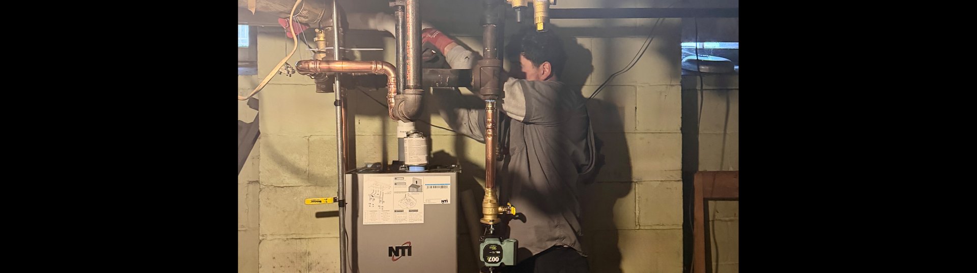 Midwest Heating & Cooling Technician Repairing Boiler in Mukwonago, WI
